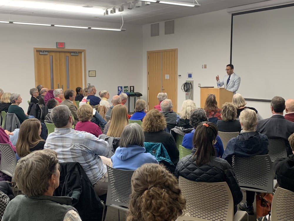 <p>William Sturkey, an assistant history professor at UNC, gives a talk about the history of race at UNC and the University's failures to reconcile it. The talk was at Chapel Hill Public Library on Tuesday, Feb. 18, 2020.</p>