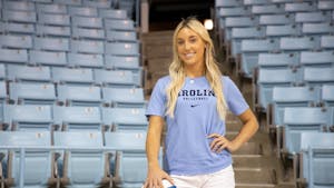 Ava Swain, a UNC volleyball recruit, poses for a portrait in Carmichael Arena on July 17, 2022. Swain enrolled early at UNC in order to begin practicing with the volleyball team in January.