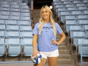 Ava Swain, a UNC volleyball recruit, poses for a portrait in Carmichael Arena on July 17, 2022. Swain enrolled early at UNC in order to begin practicing with the volleyball team in January.