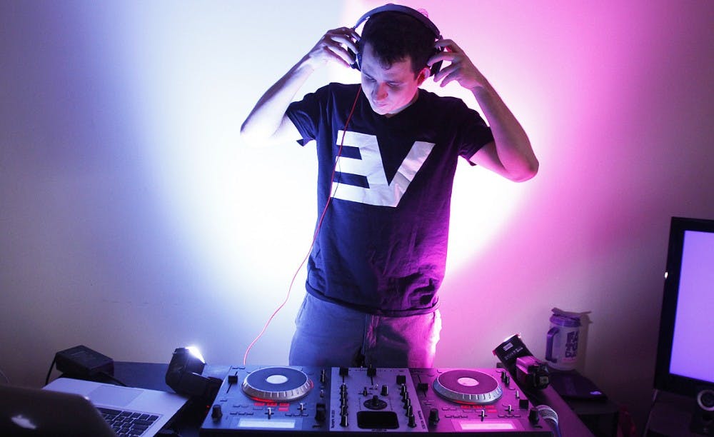 DJ Ever Vidaurri, a senior from Miami FL, practices his mixes in his living room. Vidaurri will be the DJ for the second half of Dance Marathon this year. He got into making his own mixes after he moved here from Miami and has been playing ever since. 

side note: i like this one.