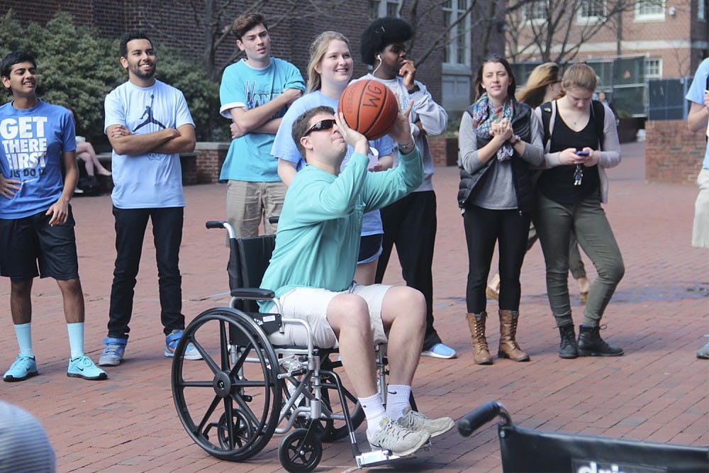 UNC Best Buddies held a wheelchair basketball game in front of Davis Library on Wednesday. Players from the varsity and JV basketball teams participated.