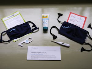 The Carolina Together Care Kit was provided to students on UNC's campus, containing two masks, a thermometer, hand sanitizer, and a no-contact key for doors and other surfaces.