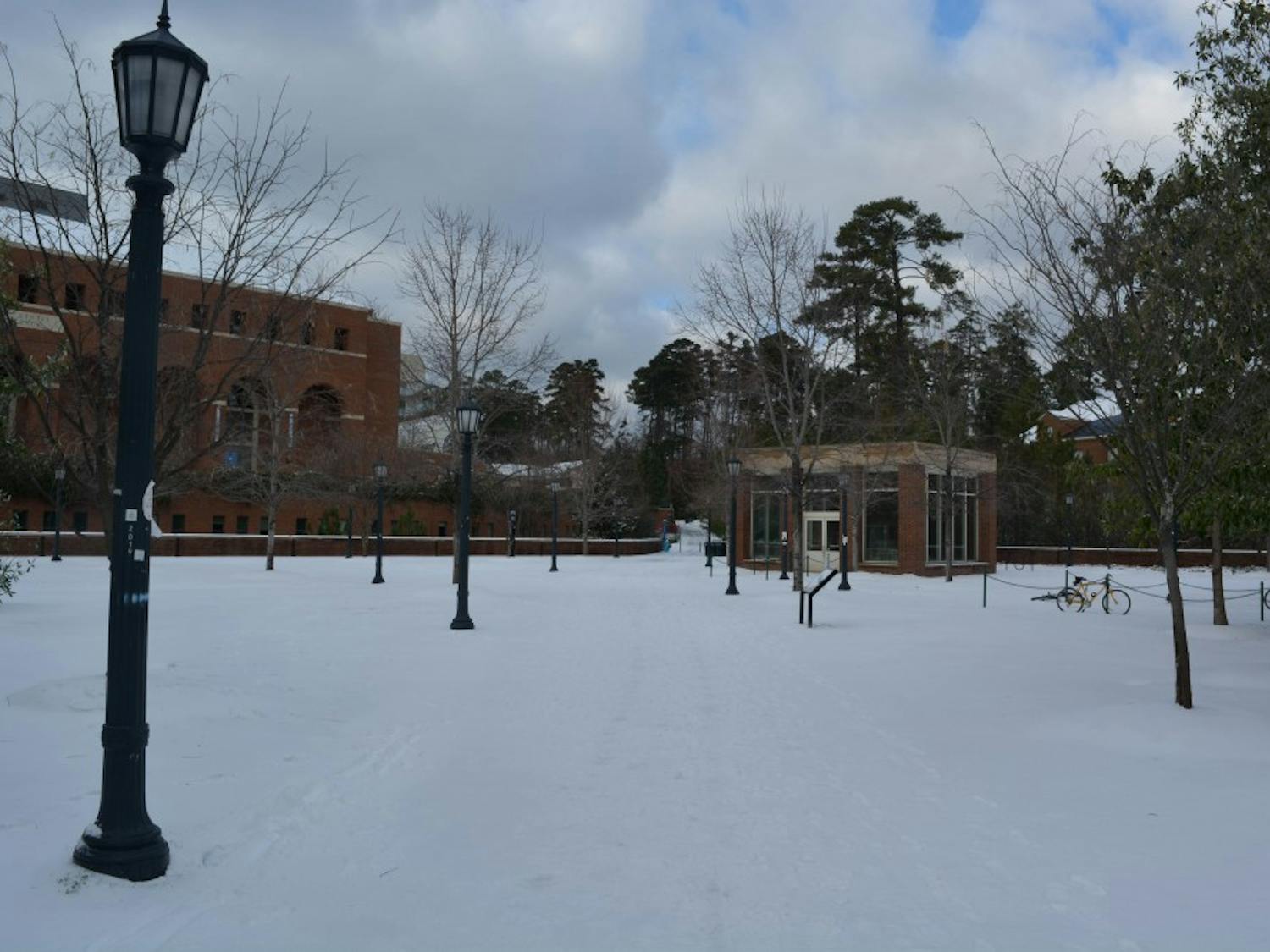 Snow covers the sidewalks in from of Rams Dining Hall.&nbsp;
