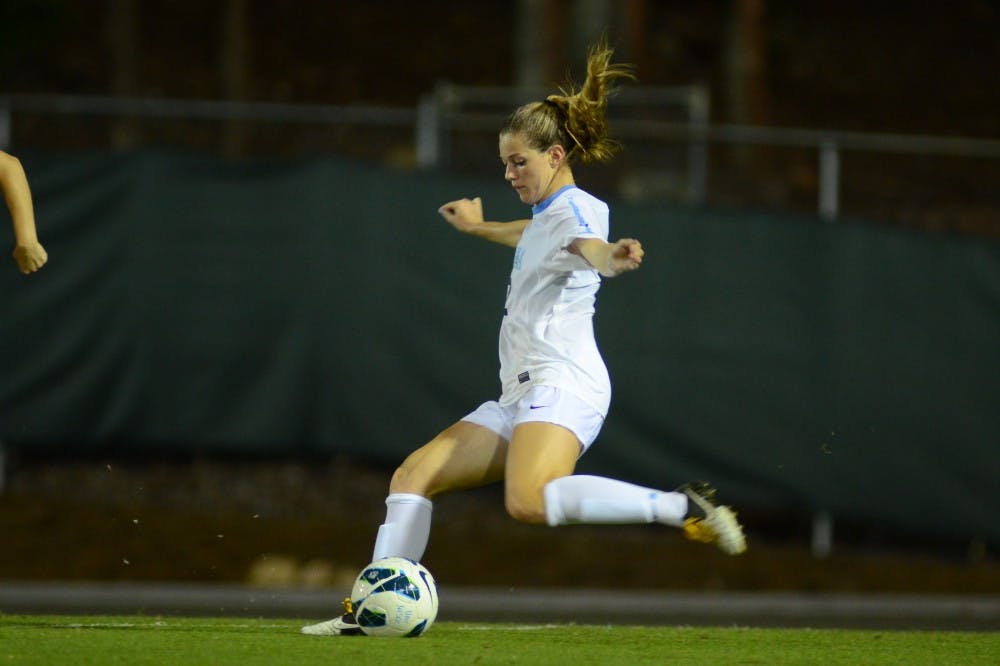 UNC Junior Kealia Ohai (7) crosses teh ball. 