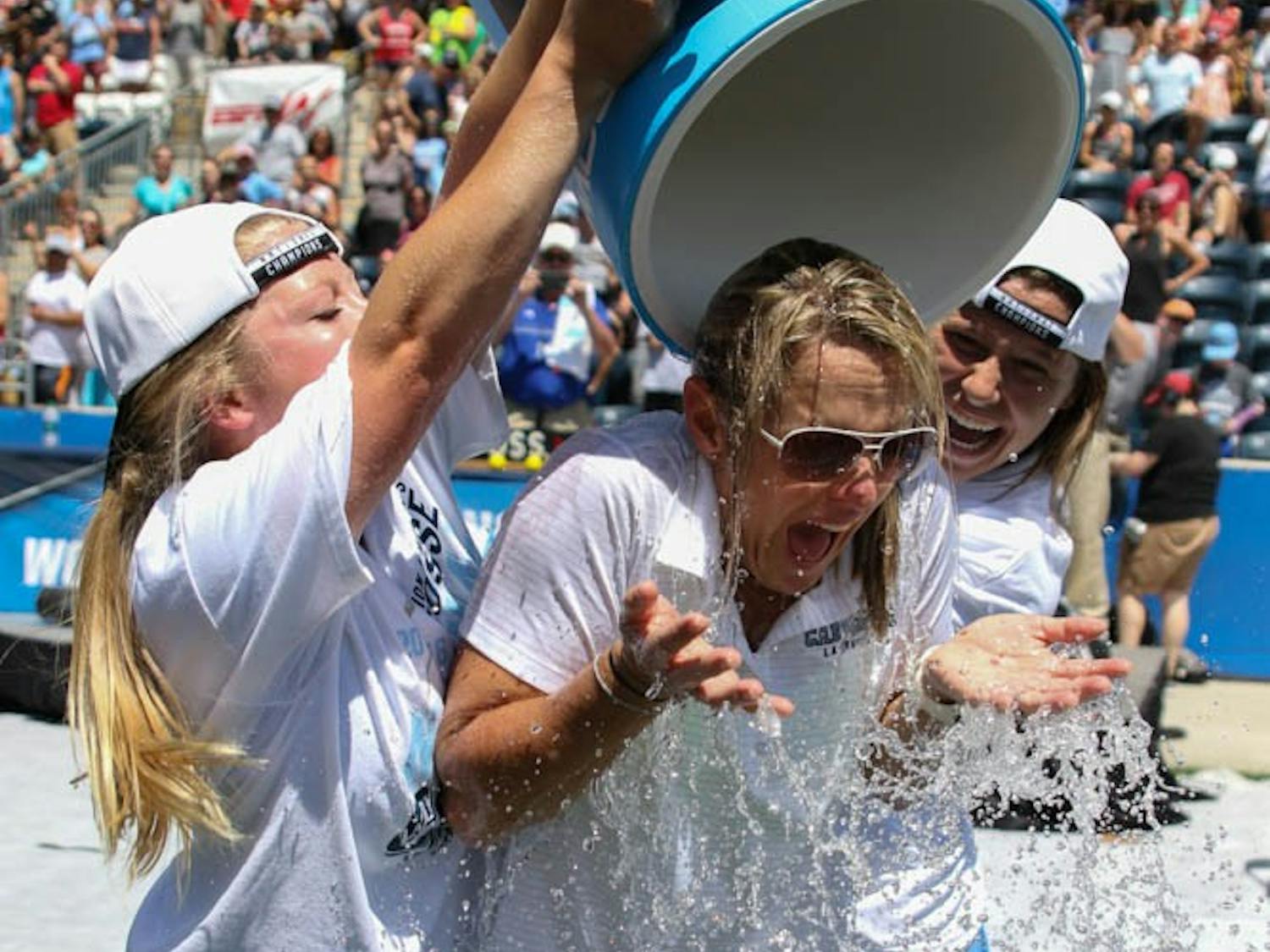 UNC women's lacrosse coach&nbsp;Jenny Levy is given a Gatorade bath by players Caylee Waters (right) and Naomi Lerner (left).&nbsp;The North Carolina women's lacrosse team defeated Maryland 13-7 to capture the NCAA championship on Sunday at Talen Energy Stadium in Chester, PA.