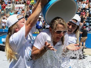 UNC women's lacrosse coach&nbsp;Jenny Levy is given a Gatorade bath by players Caylee Waters (right) and Naomi Lerner (left).&nbsp;The North Carolina women's lacrosse team defeated Maryland 13-7 to capture the NCAA championship on Sunday at Talen Energy Stadium in Chester, PA.