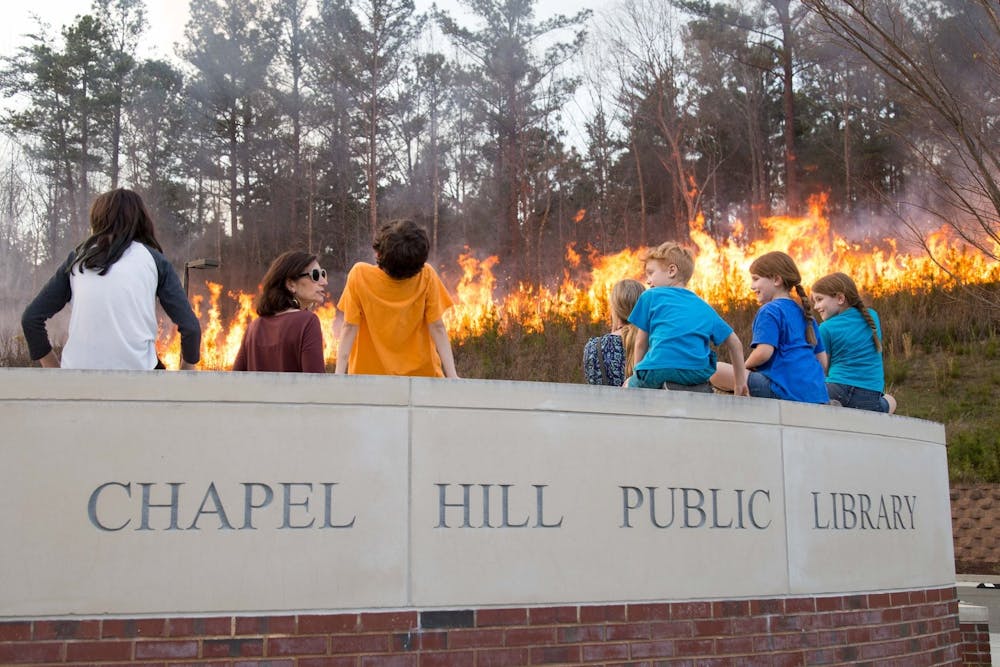 The last controlled burn at the Chapel Hill Public Library was in 2018. Photo courtesy of Hannah Olson/Town of Chapel Hill.