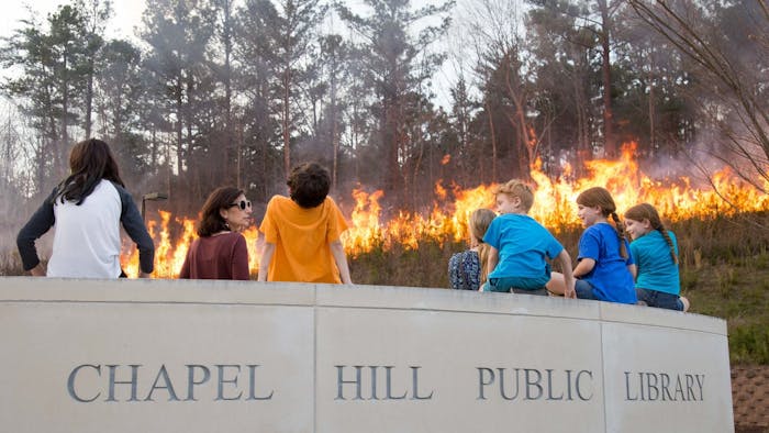 The last controlled burn at the Chapel Hill Public Library was in 2018. Photo courtesy of Hannah Olson/Town of Chapel Hill.