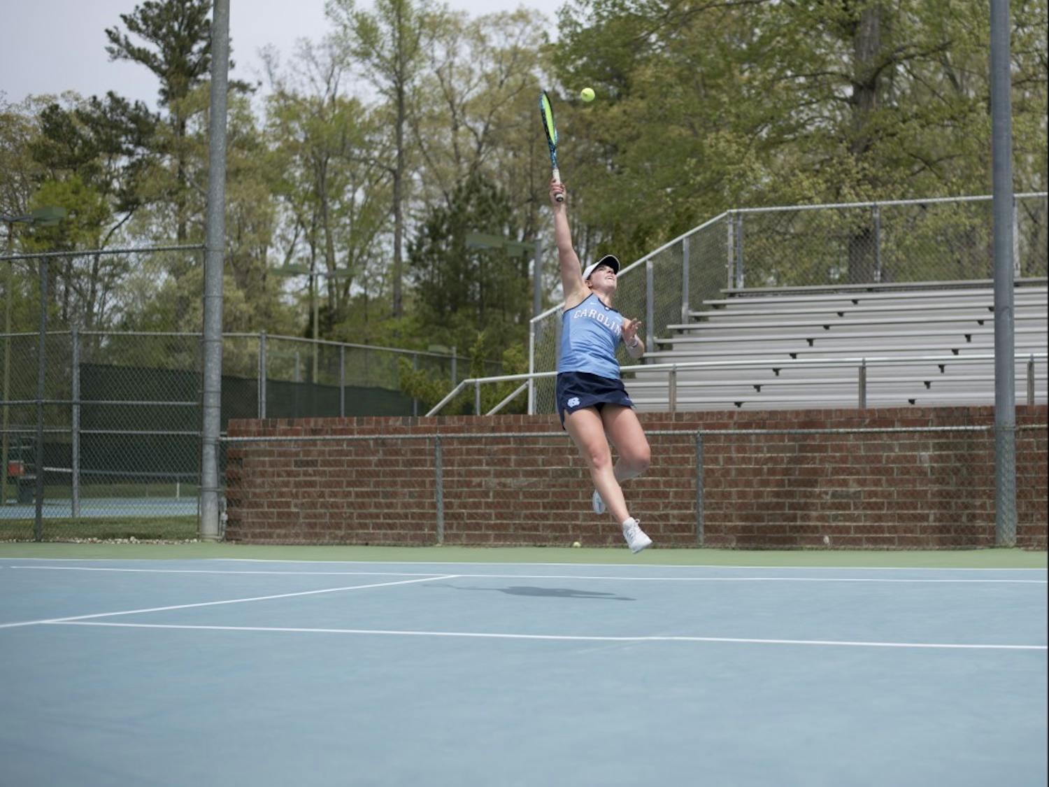 Junior Jessie Aney hits a volley against Pittsburgh on April 22 at the Cone-Kenfield Tennis Center.