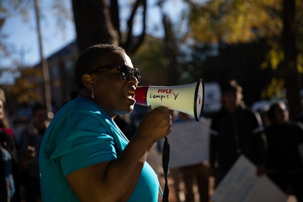 Dorothy Faulkner, 55, of Chapel Hill, addresses a crowd gathered during a CEF-organized rally to call for affordable housing in front of the Community Empowerment Fund office on Friday, Nov. 1, 2019. "It's in my heart to serve the Lord," Faulkner sung after her speech.