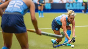 UNC senior midfielder Paityn Wirth (10) fields a pass during a field hockey exhibition against Appalachian State on Sunday, Aug. 14, 2022. 