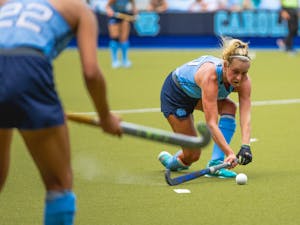 UNC senior midfielder Paityn Wirth (10) fields a pass during a field hockey exhibition against Appalachian State on Sunday, Aug. 14, 2022. 