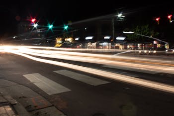 Traffic on the corner of East Franklin Street and North Columbia street leaves trails of light on Sunday, Oct. 6, 2019. 