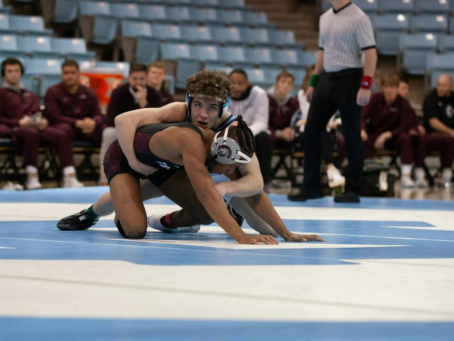First-year Spencer Moore tries to pin down his opponent during a UNC wrestling meet on Sunday, Jan. 23, 2022, match against Little Rock. Moore won his match 11-2.