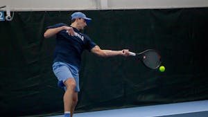 UNC graduate Ryan Seggerman hits a ball during a match against Oklahoma State at the Cone-Kenfield Tennis Center on Saturday, Jan. 28, 2023. UNC beat Oklahoma State 4-0.