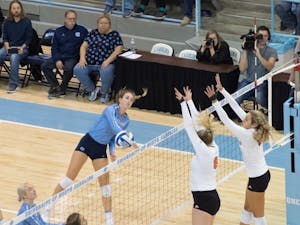 Junior Skylar Wine (6) spikes the ball during the game against Miami on Sunday Oct. 11 at Carmichael Arena. UNC won 3-1.