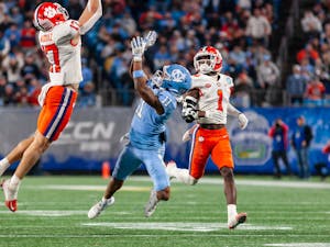 UNC junior wide receiver Josh Downs (11) attempts to catch the ball during the 2022 Subway ACC Football Championship Game against Clemson at the Bank of America Stadium on Saturday, Dec. 3, 2022. UNC fell to Clemson 39-10.