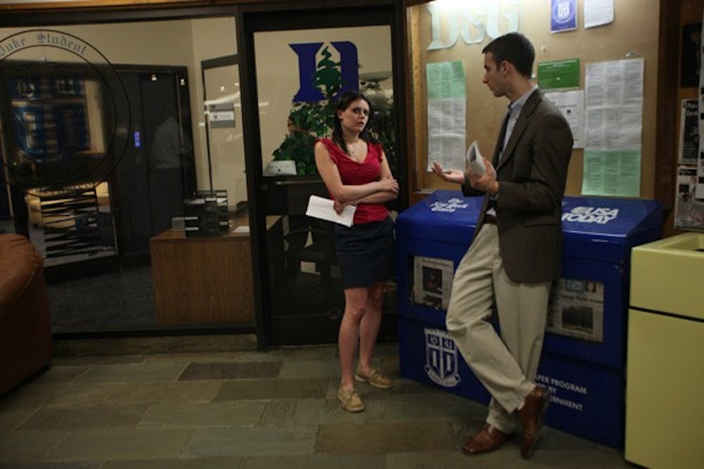 Duke College Republicans Rachel Provost and Cliff Satel, wait during a hearing. DTH/Katherine Vance