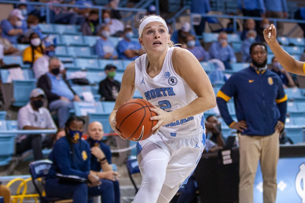 Graduate student guard Carlie Littlefield (2) runs with the ball at the game against NC A&T on Nov. 9 2021 at Carmichael Arena. UNC won 92-47.