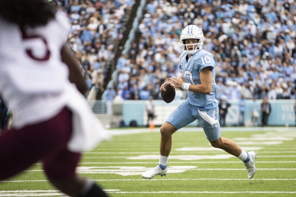 UNC first-year quarterback Drake Maye (10) seeks an open pass during a home football game at Kenan Stadium against Virginia Tech on Saturday, Oct. 1, 2022.