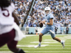 UNC first-year quarterback Drake Maye (10) seeks an open pass during a home football game at Kenan Stadium against Virginia Tech on Saturday, Oct. 1, 2022.