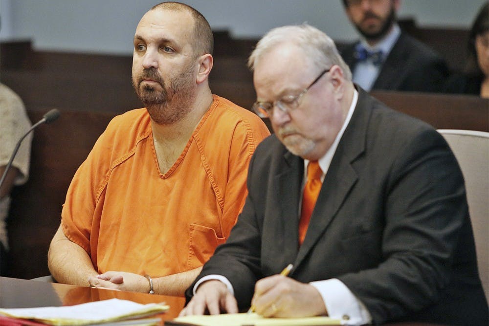 Murder defendant Craig Stephen Hicks, 46, left, listens while his co-defense counsel Terry Alford makes notes during a Monday, April 6, 2015 death penalty hearing for Hicks in Durham, N.C. Presiding Judge Orlando Hudson found the shooting deaths of three Muslim college students at Finley Forest residential complex in Chapel Hill in February 2015 made the Hicks case eligible for the death penalty. (Harry Lynch/Raleigh News &amp; Observer/TNS) 