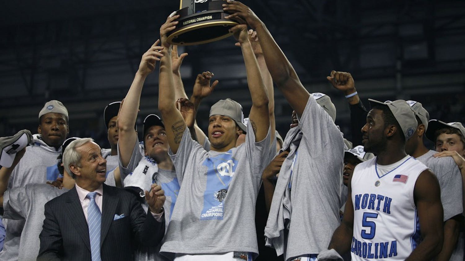 Danny Green raises the 2009 NCAA championship trophy with his team. Green has since gone on to win the NBA championship with the San Antonio Spurs.