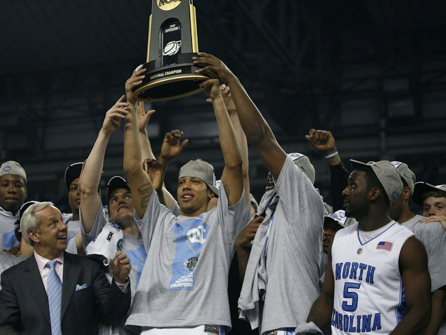 Danny Green raises the 2009 NCAA championship trophy with his team. Green has since gone on to win the NBA championship with the San Antonio Spurs.