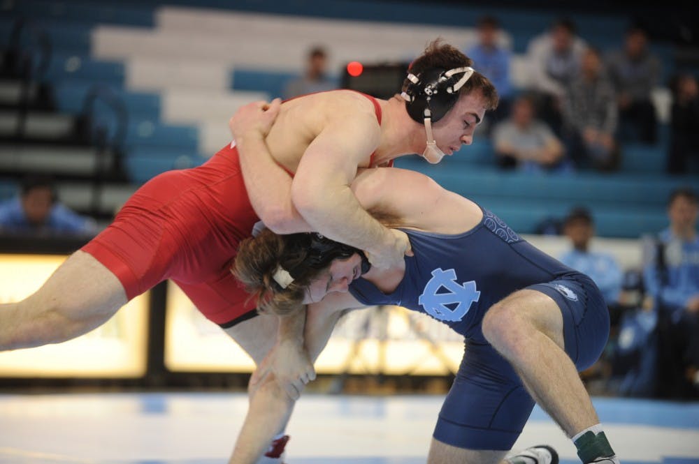 UNC senior Chip Ness suffers a takedown from Cornell sophomore Max Dean in a bout lost 2-3. No. 9 Cornell defeated UNC 29-5 on Saturday, Feb. 17, 2019 in the Carmichael Arena.