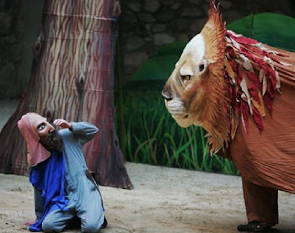 The Knight, played by creator Jan Burger, faces a lion, played by Brandon Thomas and Gilberto Sibrian. DTH/Andrew Dye