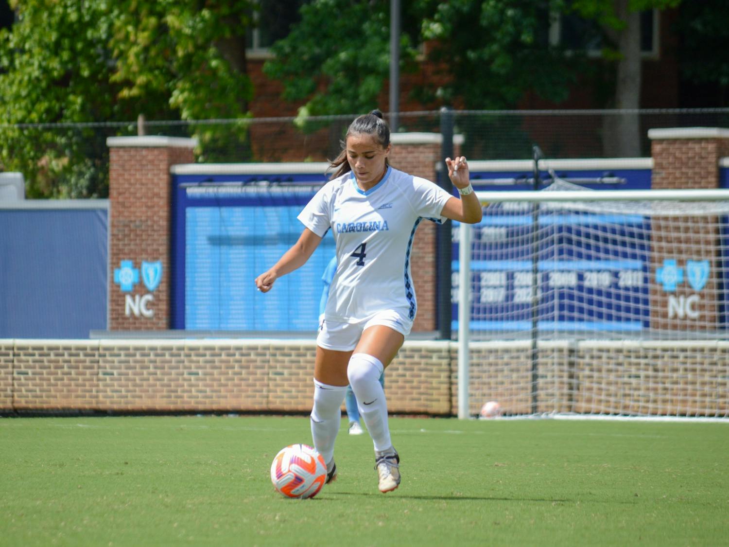 Junior defender Paige Tolentino (4) keeps possession of the ball during the first exhibition game of the season on August 7, 2022. UNC won 5-0 over VCU.&nbsp;