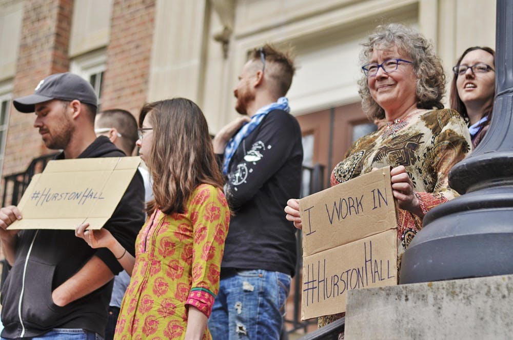 The Real Silent Sam Coalition read their manifesto outside of Saunders Hall on Monday. Altha Cravey works in the geography department on the third floor of Saunders Hall and explains she has "been walking past that brass plaque for a long time, so [she is] very happy to see all of this mobilizing." 