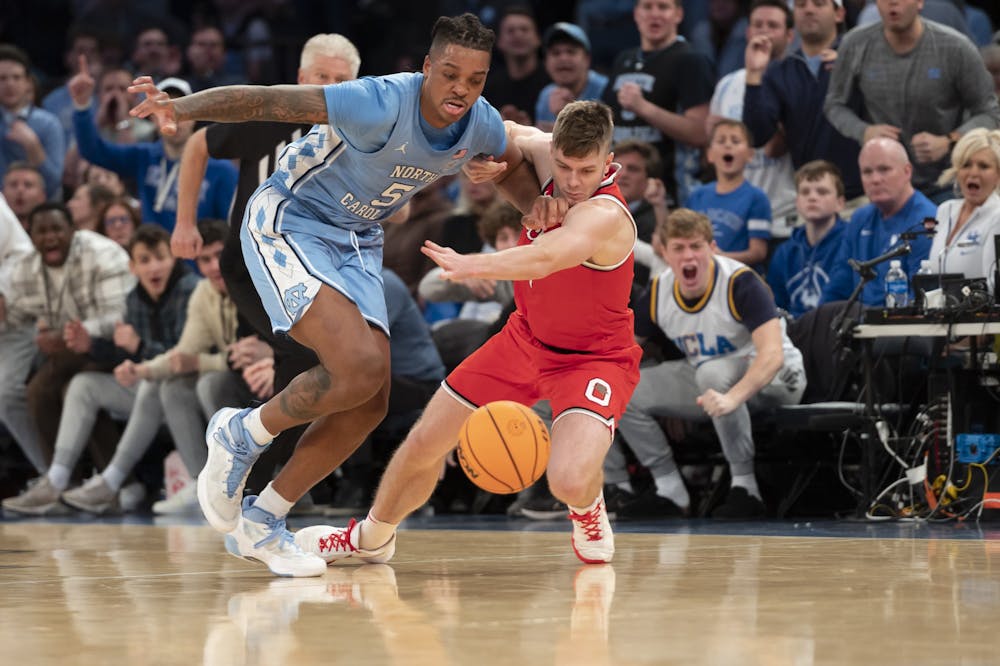 UNC senior forward/center Armando Bacot (5) steals the ball from Ohio State during the men's basketball game against Ohio State at Madison Square Garden on Saturday, Dec. 17, 2022. UNC beat Ohio State 89-84.