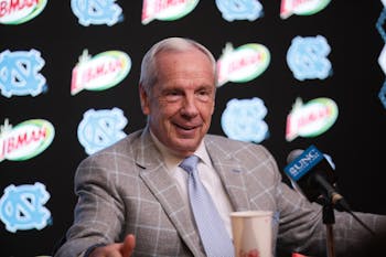 Head Coach Roy Williams speaks at a post-game press conference after a 94-71 win against Miami. The victory broke the Tar Heels' losing streak and allowed Williams to surpass Dean Smith in all-time wins. 