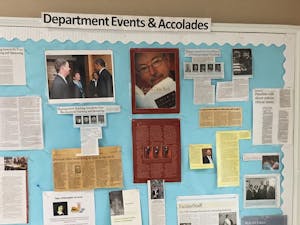 Jan Boxill is featured with Chancellor Folt and President Obama on a bulletin board in Caldwell Hall celebrating philosophy professors’ work.