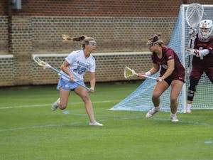 UNC sophomore attacker Caitlyn Wurzburger (13) dodges around the crease against Virginia Tech on Saturday, March 26, 2022 at the Dorrance Field in Chapel Hill. UNC won 20-8.
