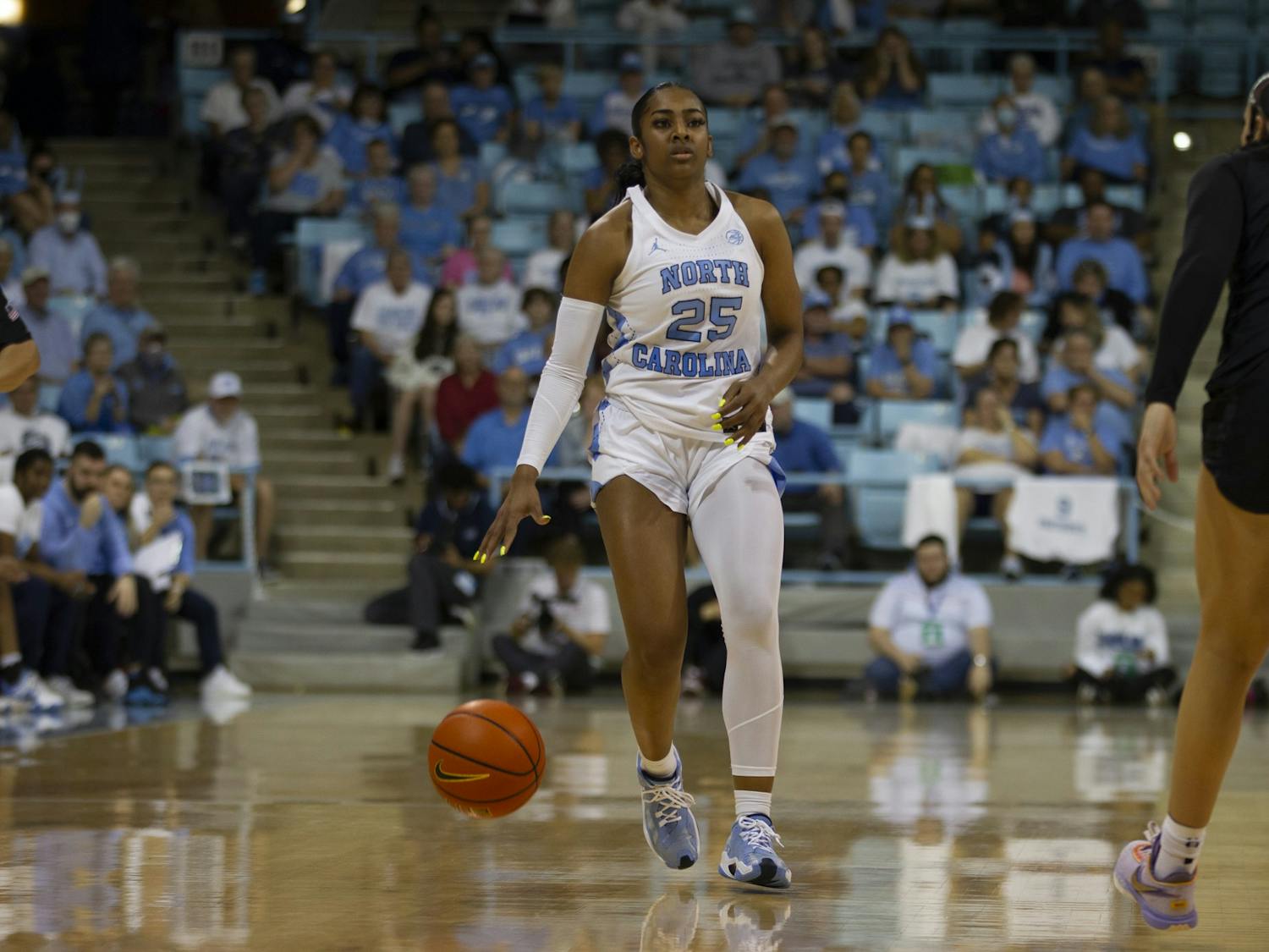 Junior guard Deja Kelly (25) dribbles the ball up court during the womens basketball game against Virginia Tech on Thursday, Feb. 23, 2023 at Carmichael Arena.