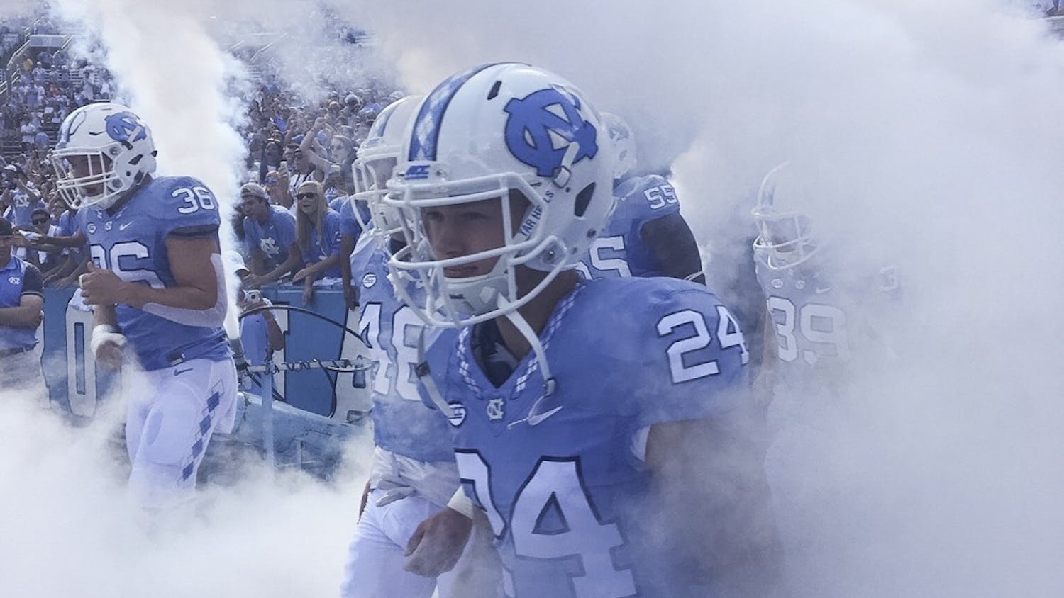 North Carolina defensive back Zach Goins (24) prepares to run out of the smoke filled tunnel. Photo Courtesy of Zach Goins.