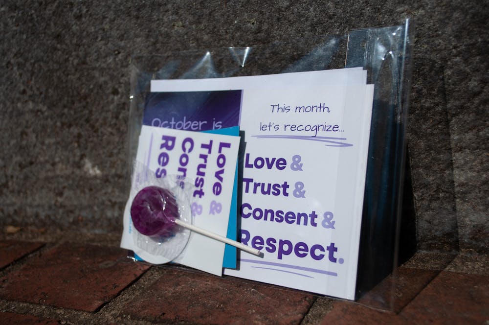 DTH Photo Illustration. Local restaurants are handing out goodie bags for Relationship Violence Awareness month. Bag photographed on Monday, Oct. 17, 2022.