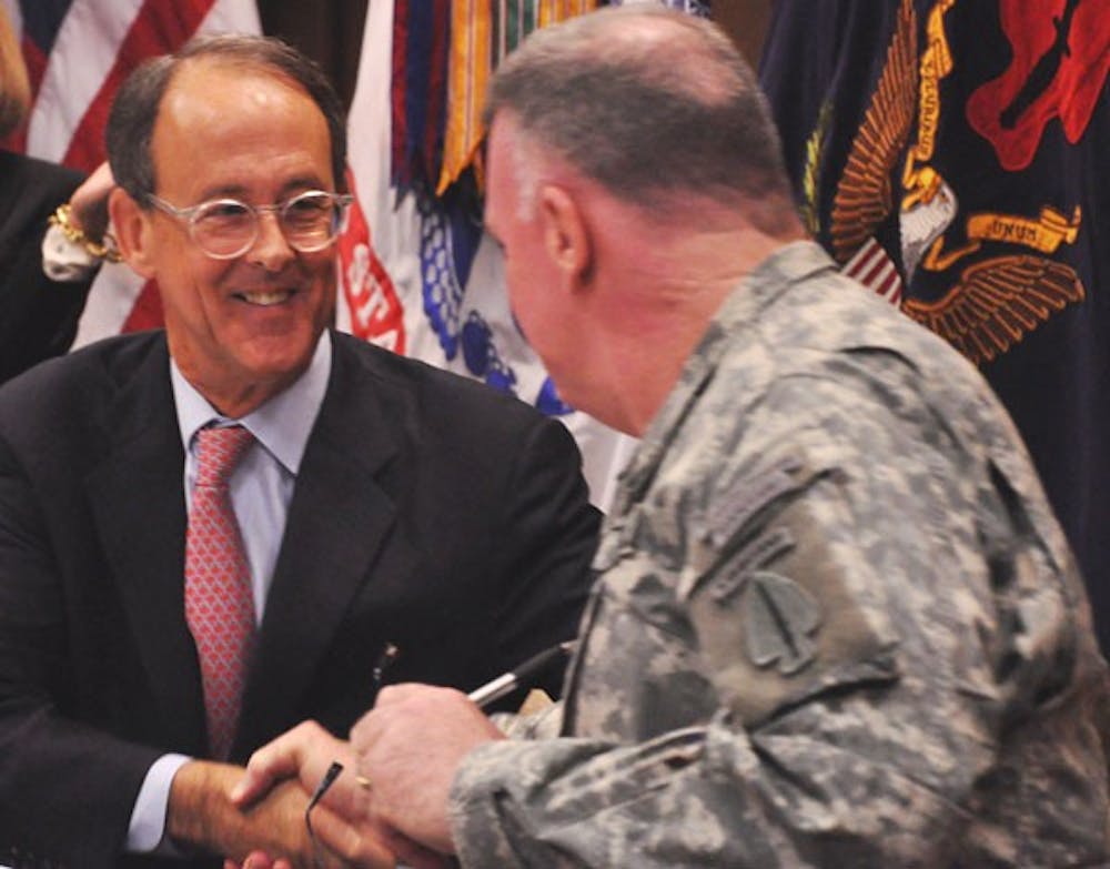 UNC-system President Erskine Bowles, left, and Lt. Gen. John Mulholland Jr. signed an agreement Thursday.