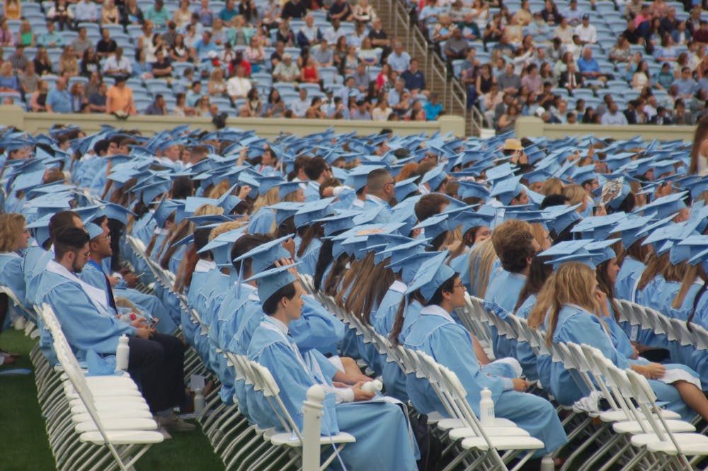 Graduating seniors sit in the crowd during UNC's 2019 spring commencement ceremony. 