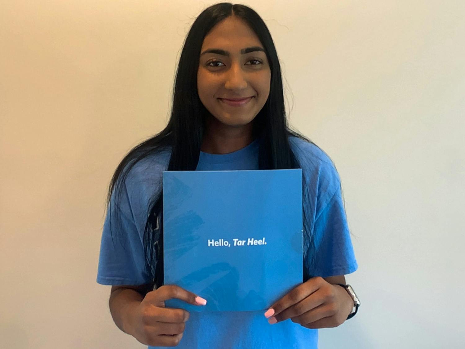 Nikita Umesh poses with her UNC acceptance letter for a virutal portrait in her home on Wednesday, May 26th, 2021. Umesh intends to major in Biology and is excited about the upcoming fall semester.