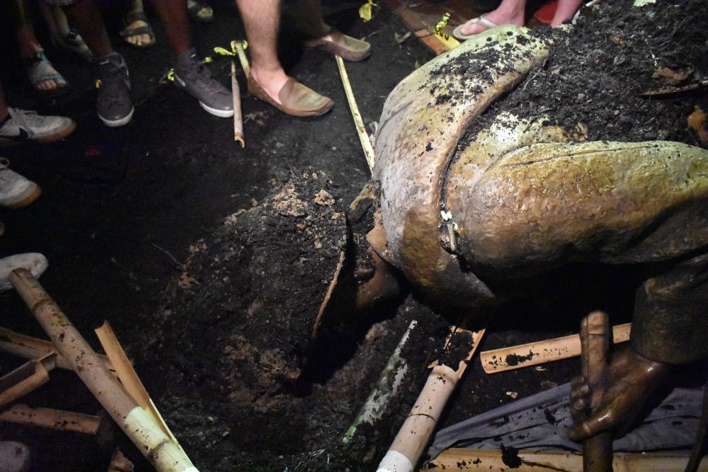 Silent Sam toppled in protest the night before classes begin