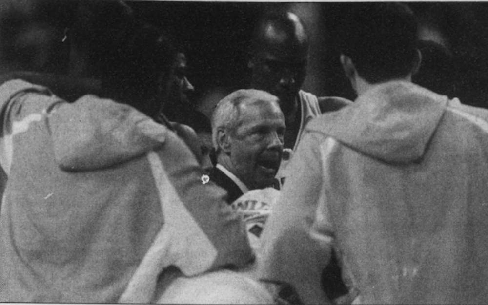 DTH Archive. Head men's basketball Coach Roy Williams talks to his team at halftime of an 87-71 final four victory over Michigan State University, April 2, 2005. The team would go on to top Illinois 75-70 to win UNC's 4th National Championship.