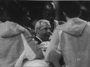 DTH Archive. Head men's basketball Coach Roy Williams talks to his team at halftime of an 87-71 final four victory over Michigan State University, April 2, 2005. The team would go on to top Illinois 75-70 to win UNC's 4th National Championship.