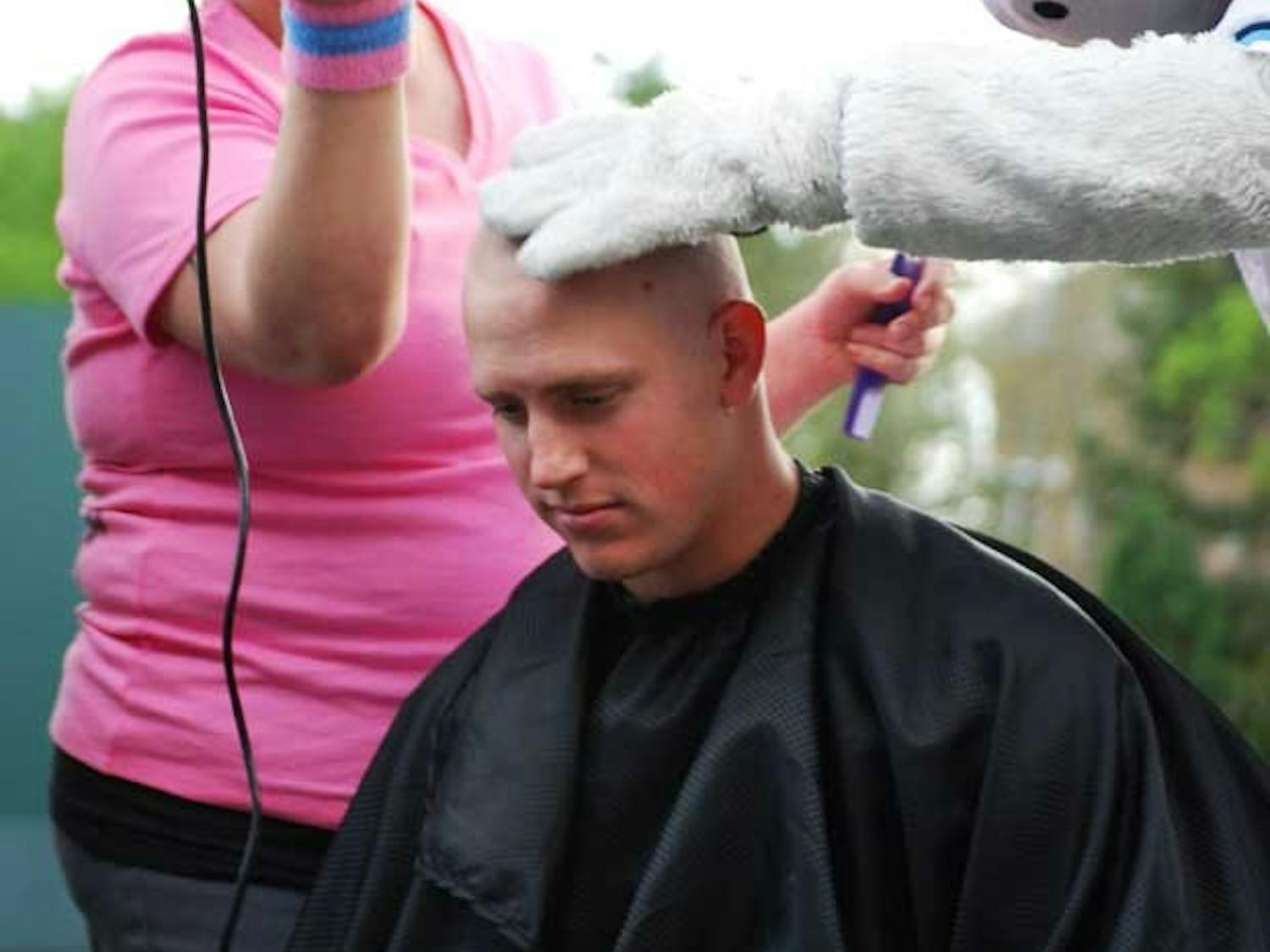 Senior 1st Baseman Jesse Wierzbicki gets his head shaved during BaseBald for the Cure. The event, which raised over $13,000 was organized by Tar Heel bullpen catcher and cancer survivor Chase Jones to raise money for pediatric oncology.