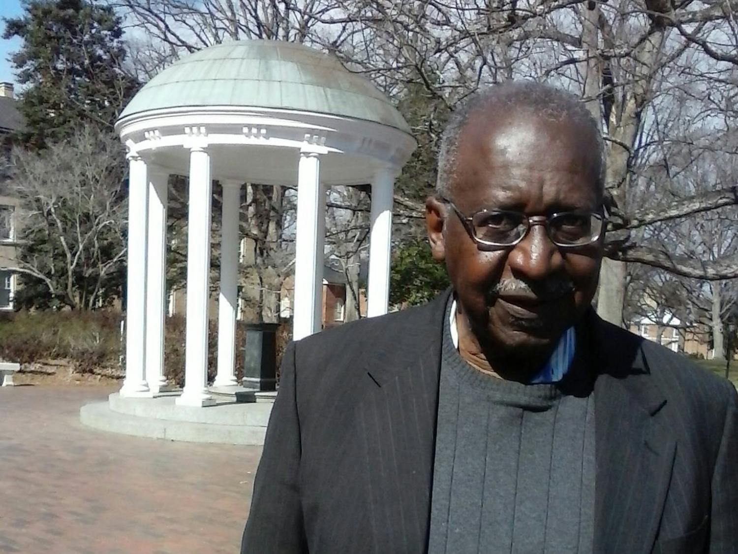 Walter Jackson, '67, pictured in front of UNC's worldwide landmark, the Old Well. Walter Jackson is a member of the UNC Black Pioneers, UNC alumni who marched on Franklin Street during the Civil Rights Movement. Photo courtesy of Walter Jackson. 