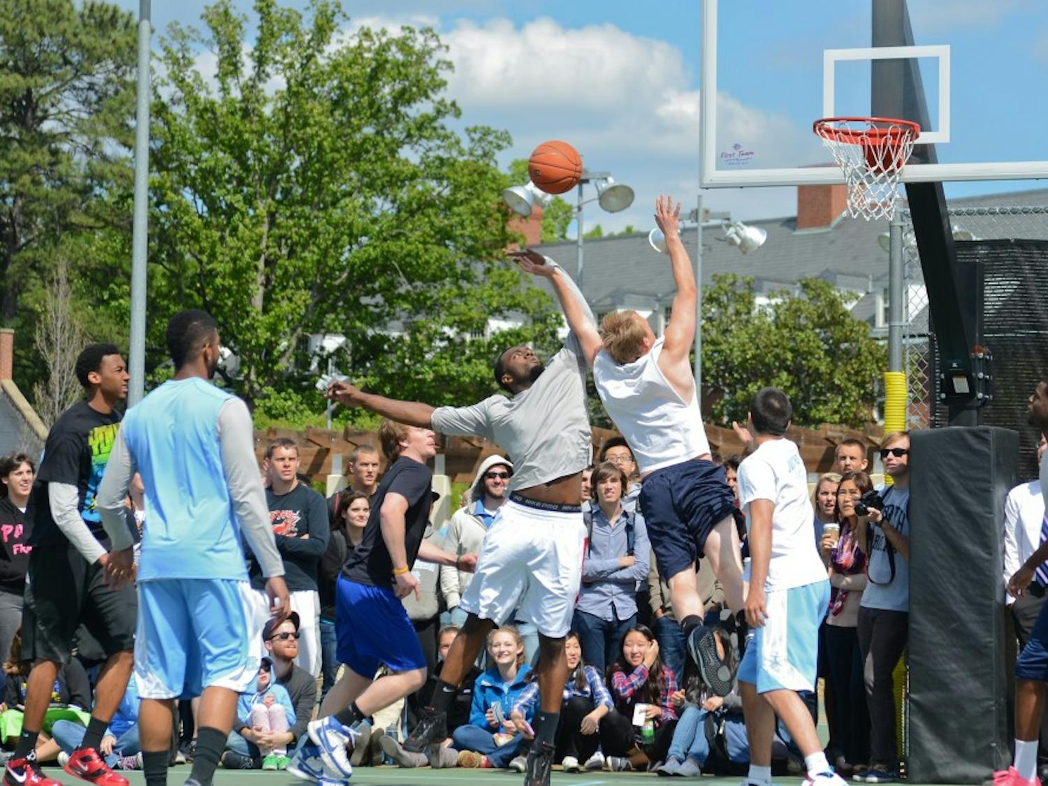	Carolina Basketball players play pick-up basketball games with students at Cobb Courts April 11th, 2012.