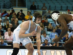 UNC redshirt senior A.C. Headlee wrestles against his opponent in the match against Arizona State in the Carmichael Arena on Sunday, Feb. 23, 2020. UNC lost to Arizona 9-22.