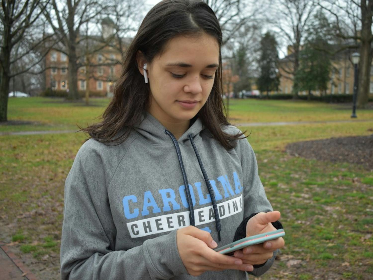 Transfer student, Natalia Aquino, uses her AirPods on her walk to class, despite her preference for Beats Headphones.